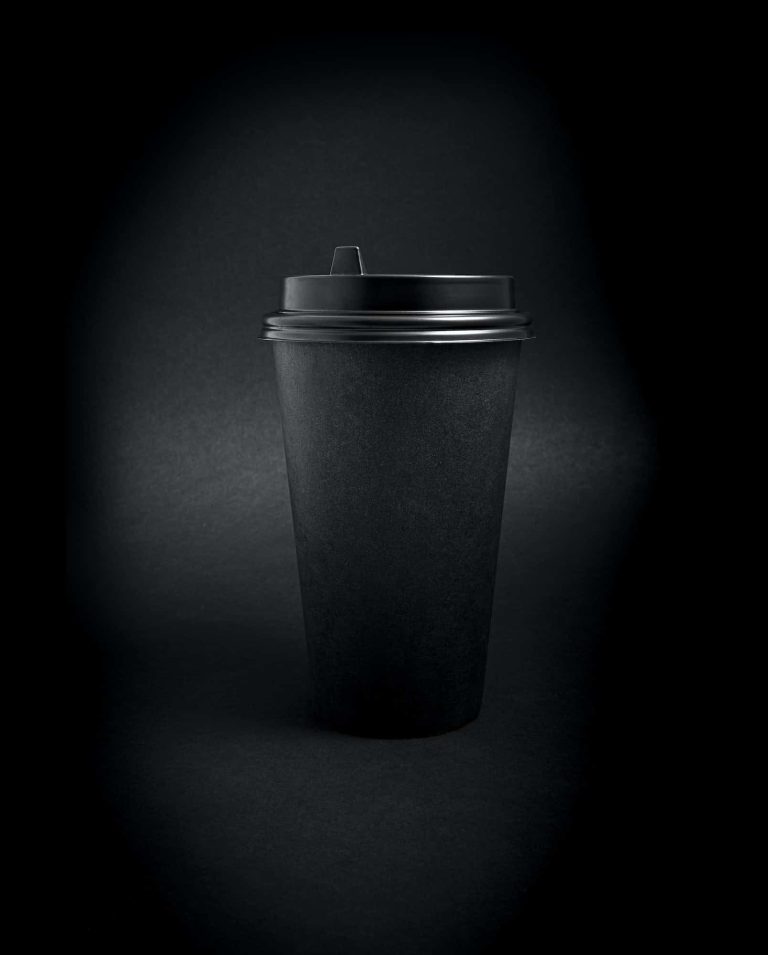 black-takeaway-paper-coffee-cup-over-black-background